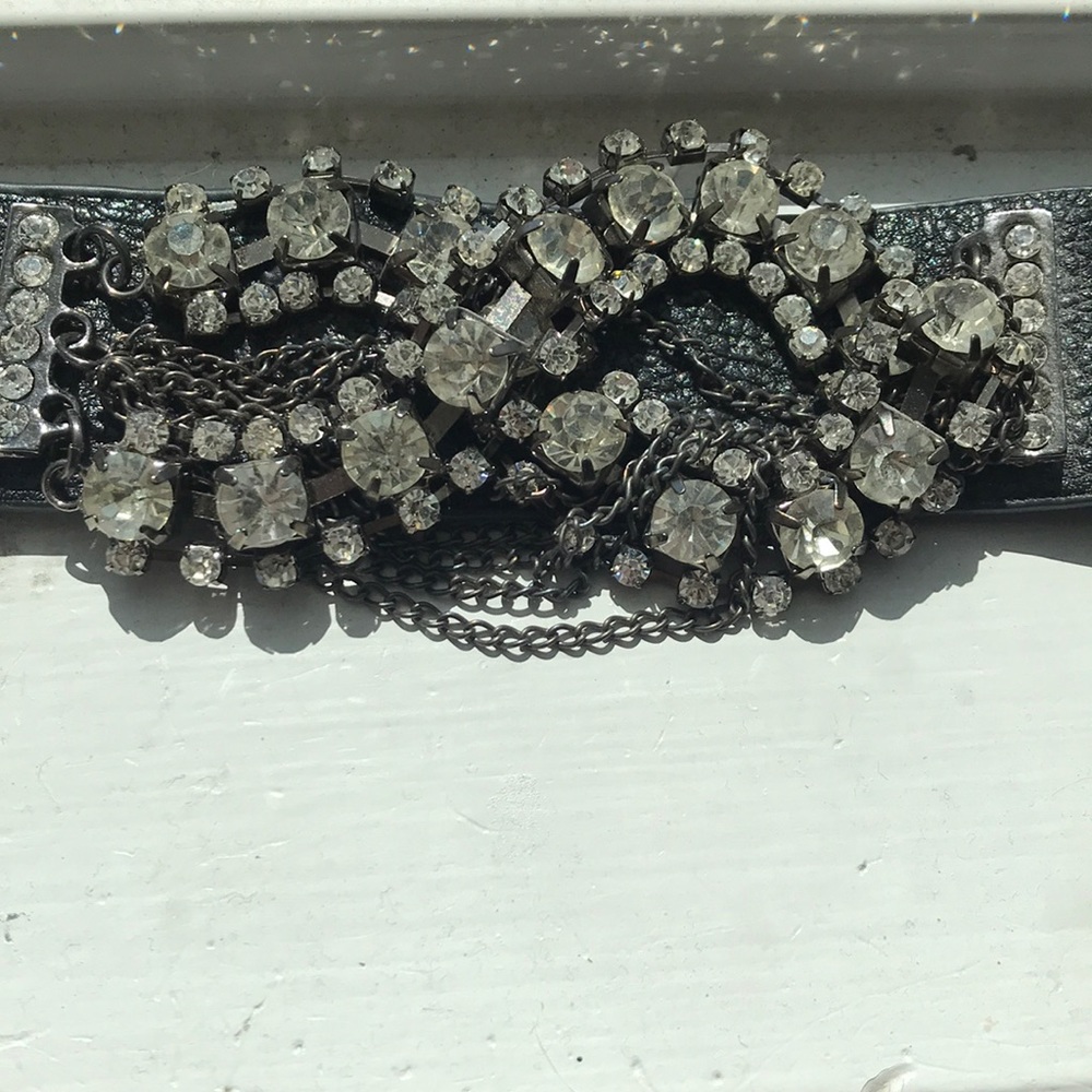 Black studded bracelet.